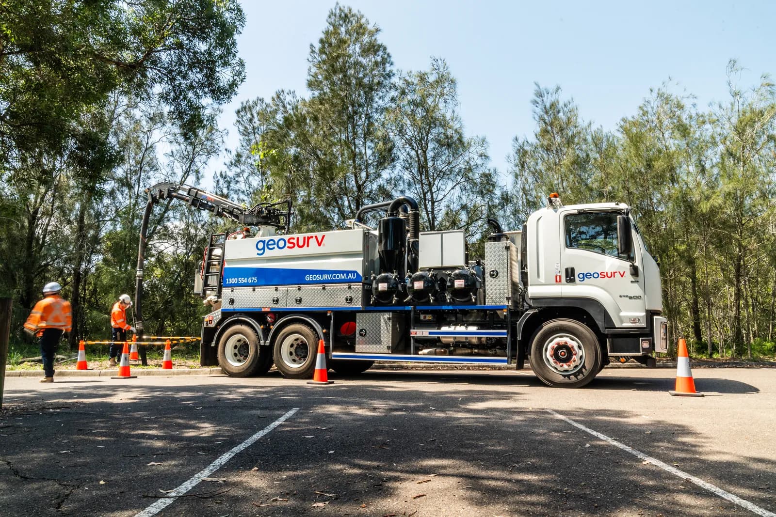 Geosurv crew performing non-destructive vacuum excavation to expose services