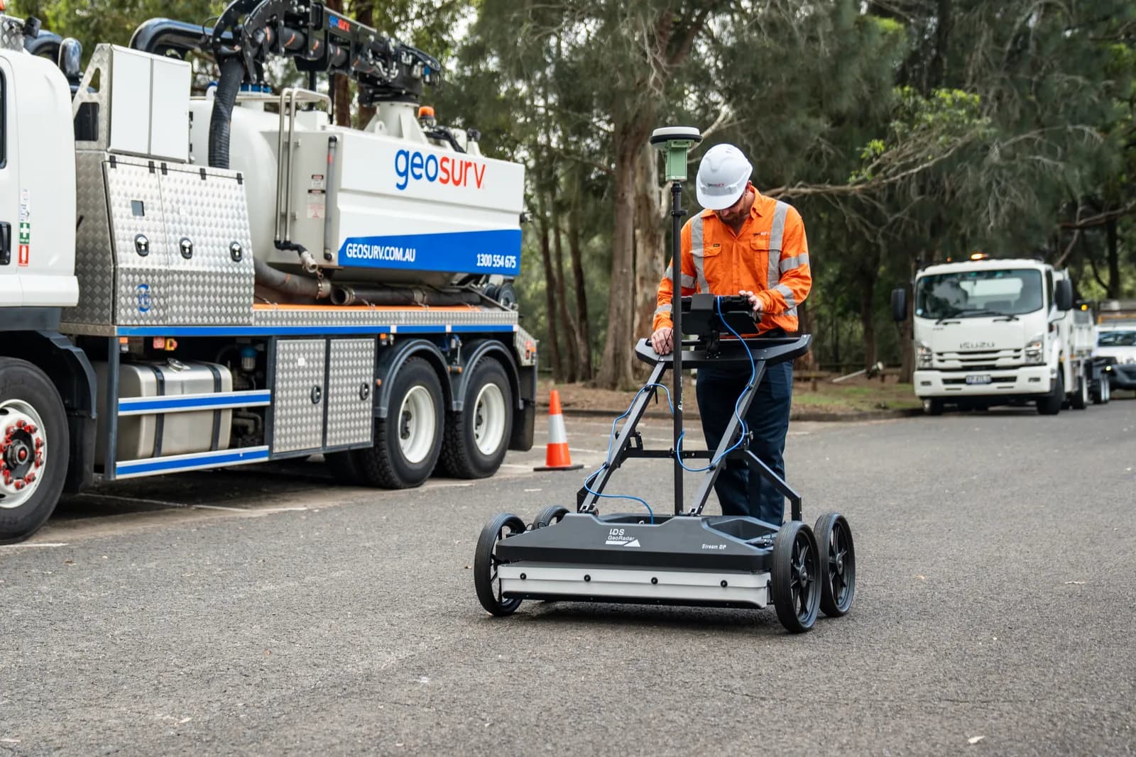 Geosurv operator scanning for buried utilities with ground penetrating radar