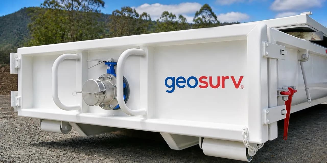 Geosurv crew loading spoil at a tipper truck on site