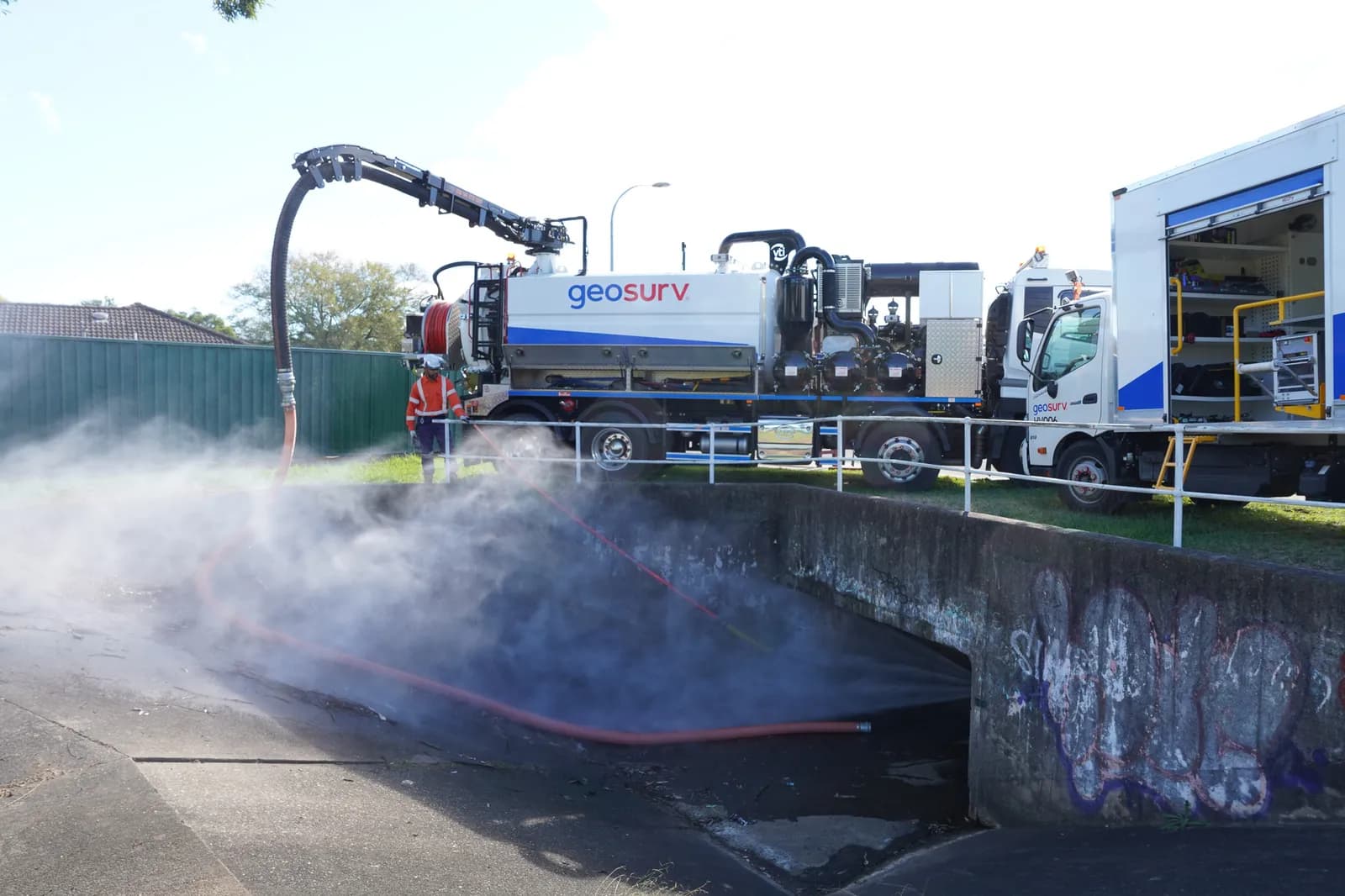 Geosurv crew cleaning and inspecting a large stormwater culvert