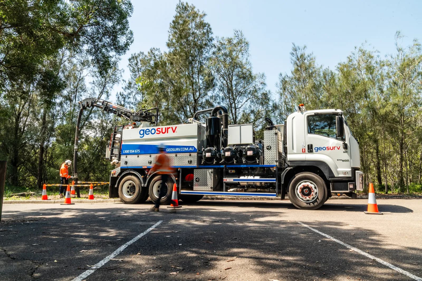 Geosurv crew performing non-destructive vacuum excavation to expose underground services